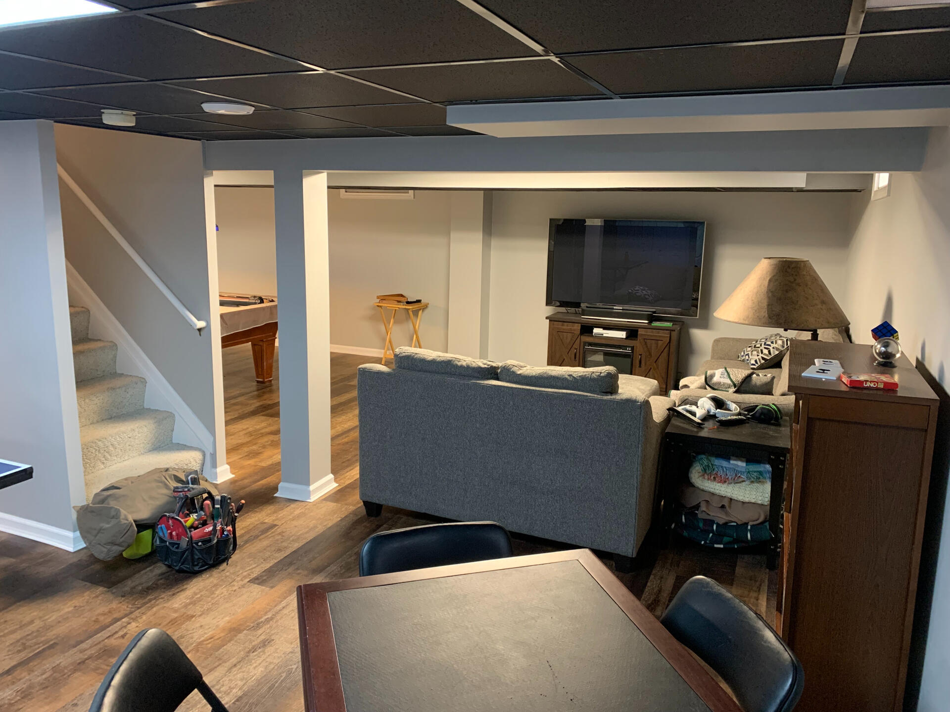 Multi-Zone Basement Living Space with Lounge and Game Table – Royal Oak, MI Versatile basement living space with open layout for lounging and casual games, part of a full interior renovation in Royal Oak, Michigan