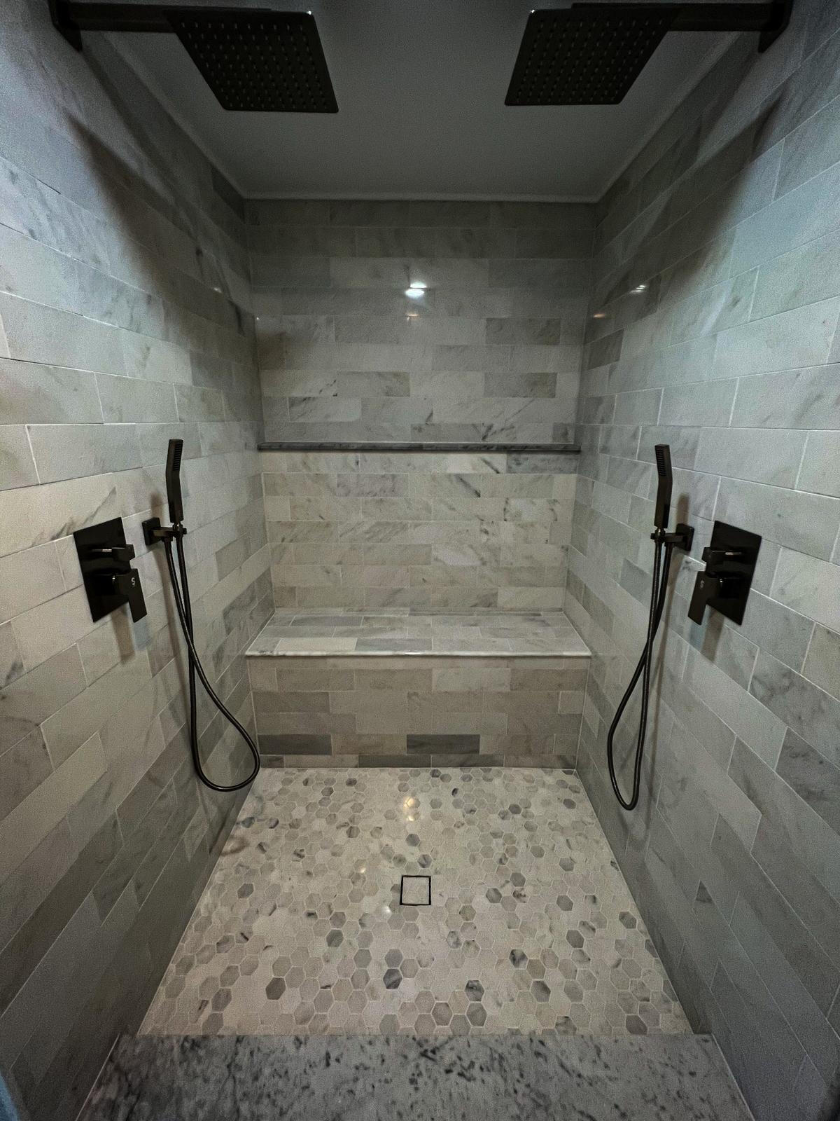 Custom Tile Tub Surround with Matte Black Fixtures – Pleasant Ridge, MI Modern bathtub with geometric tile surround and matte black plumbing fixtures – bathroom remodel in Pleasant Ridge, Michigan